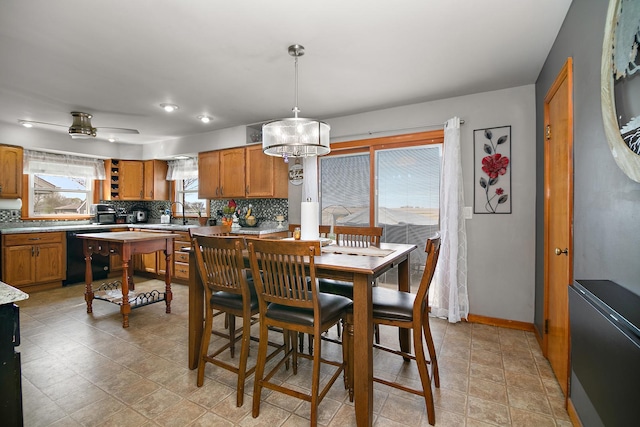 493 W Chebanse Ave, Chebanse, IL 60922 - dining space with baseboards and an inviting chandelier