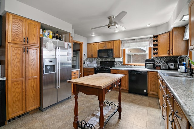 493 W Chebanse Ave, Chebanse, IL 60922 - kitchen with open shelves, visible vents, a sink, black appliances, and ceiling fan