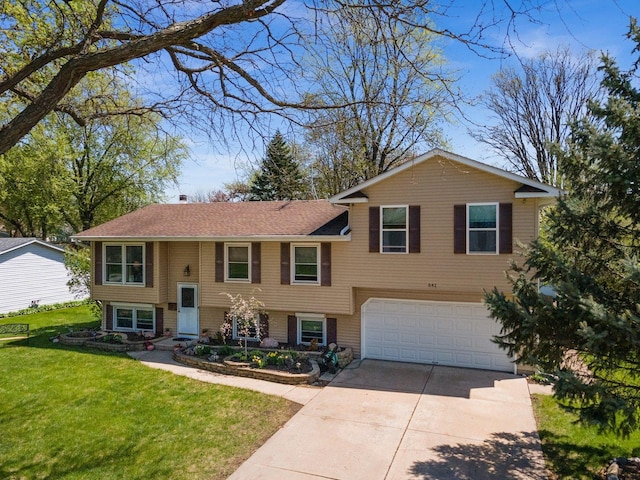 bi-level home with roof with shingles, an attached garage, concrete driveway, and a front lawn