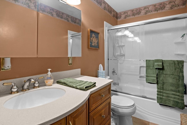 full bath featuring vanity, enclosed tub / shower combo, and toilet