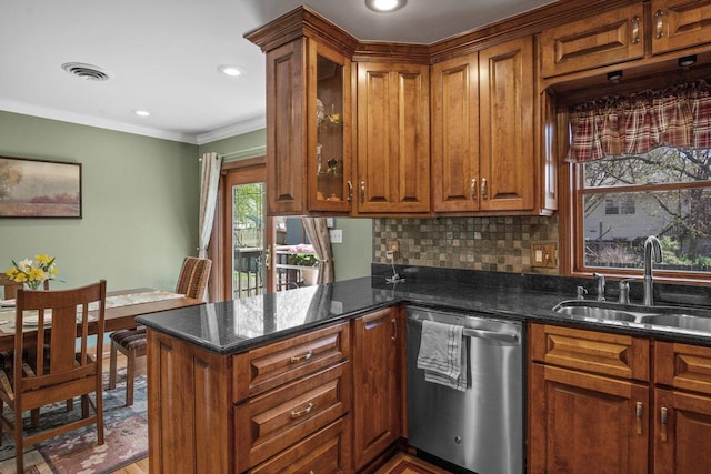 kitchen with visible vents, brown cabinetry, a peninsula, a sink, and dishwasher