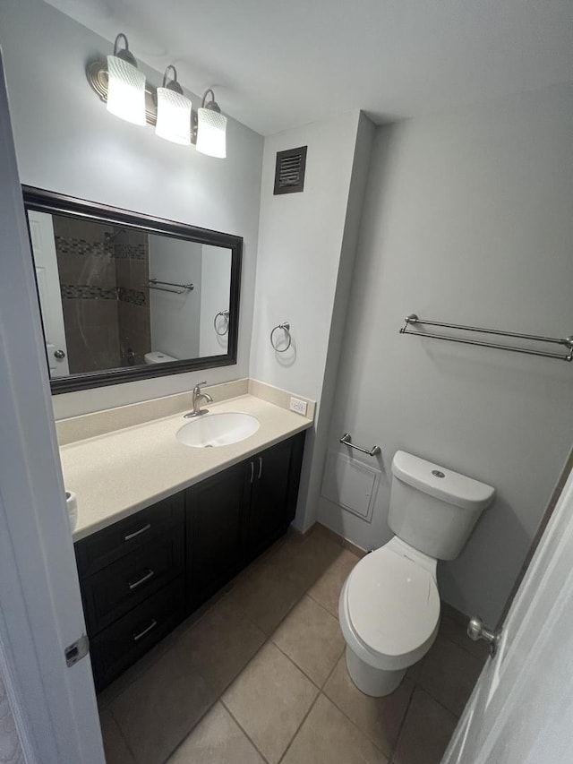 6150 N Kenmore Ave Unit 15B, Chicago, IL 60660 - full bathroom featuring toilet, vanity, tile patterned flooring, and a shower