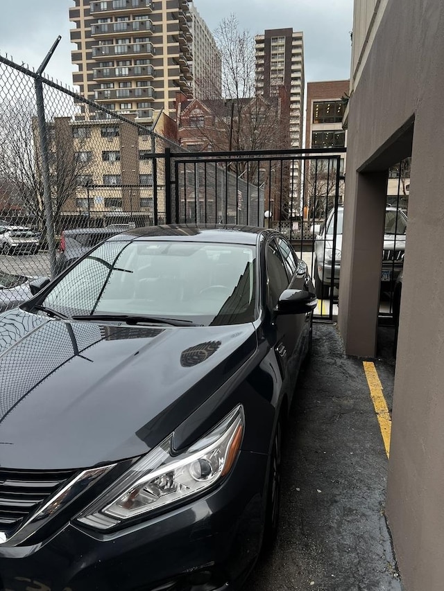 6150 N Kenmore Ave Unit 15B, Chicago, IL 60660 - uncovered parking lot featuring a view of city