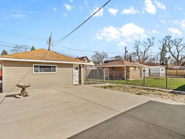 exterior space with an outbuilding, fence, and a patio area