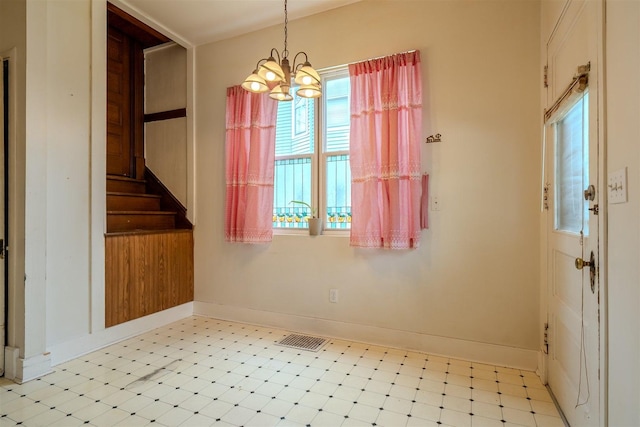 unfurnished dining area with visible vents, light floors, a chandelier, and a wealth of natural light