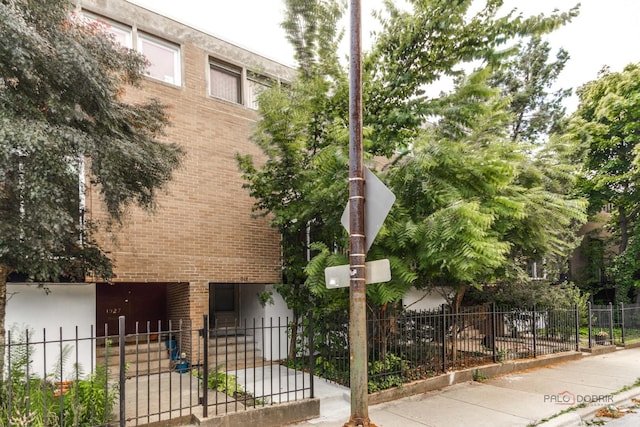 view of property with fence
