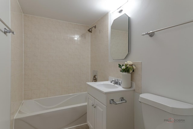 bathroom with backsplash, tub / shower combination, vanity, and toilet