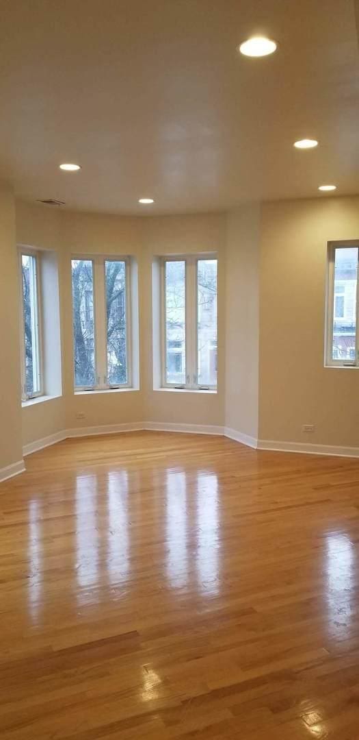 unfurnished room with baseboards, recessed lighting, and light wood finished floors