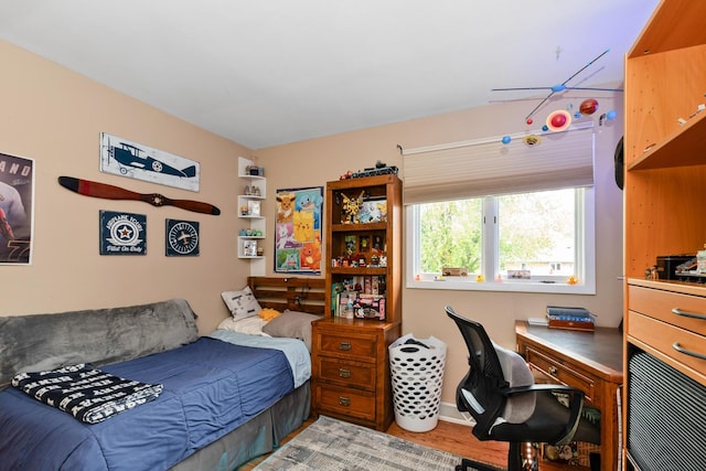 bedroom featuring light wood finished floors