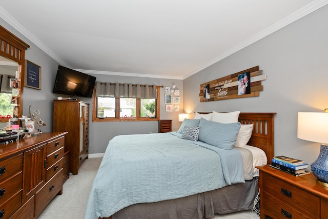 bedroom featuring baseboards, ornamental molding, and light carpet