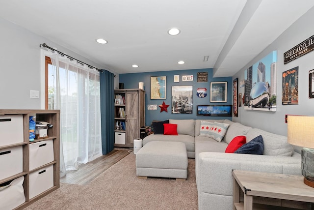 living room with recessed lighting and wood finished floors
