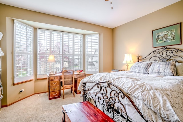 bedroom with baseboards and carpet flooring