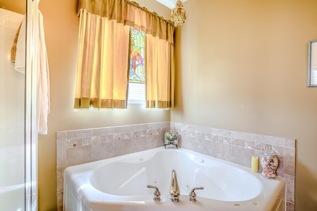 bathroom featuring a tub with jets