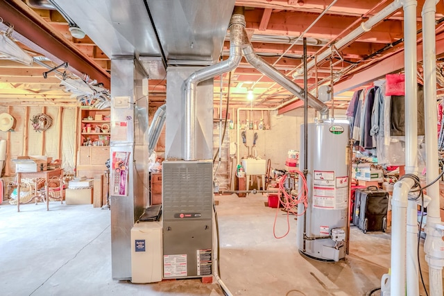 utility room with a sink and gas water heater