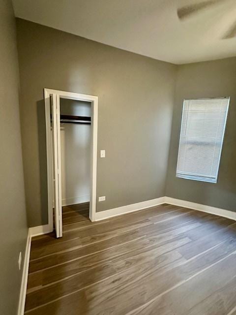 4024 W Polk St, Chicago, IL 60624 - unfurnished bedroom with baseboards and dark wood-style floors