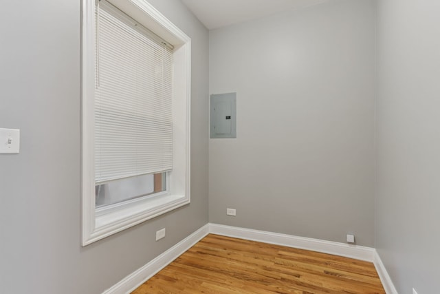 3220 W Polk St, Chicago, IL 60624 - empty room featuring electric panel, wood finished floors, and baseboards