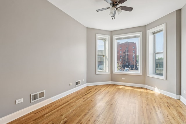 3220 W Polk St, Chicago, IL 60624 - spare room featuring light wood-style flooring, baseboards, and ceiling fan