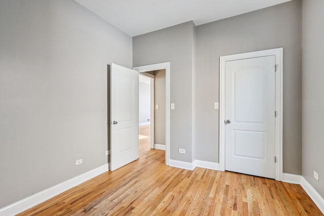 3220 W Polk St, Chicago, IL 60624 - unfurnished bedroom with light wood finished floors and baseboards