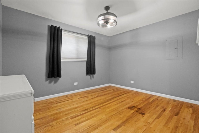 24860 W Forest Dr, Lake Villa, IL 60046 - spare room featuring light wood-style flooring, baseboards, and electric panel