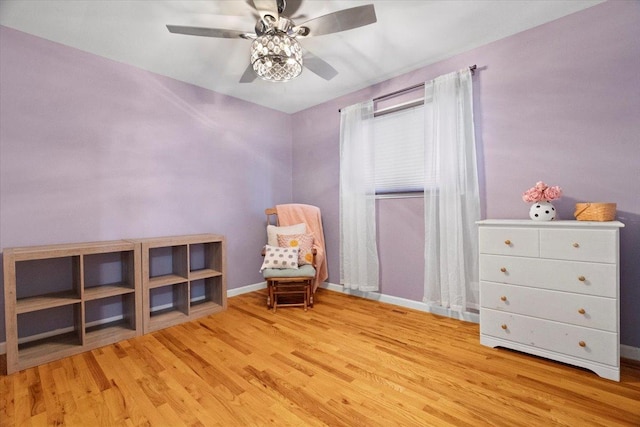24860 W Forest Dr, Lake Villa, IL 60046 - living area featuring wood finished floors, ceiling fan, and baseboards