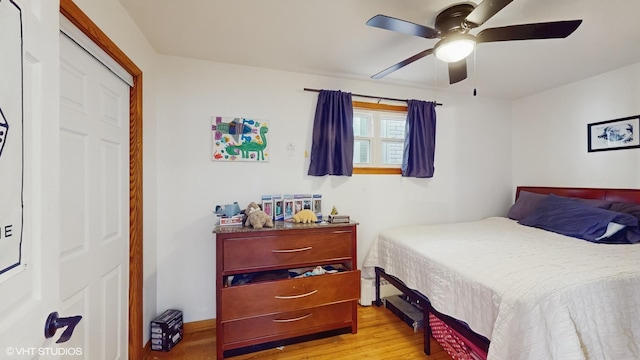 bedroom featuring light wood-type flooring and a ceiling fan