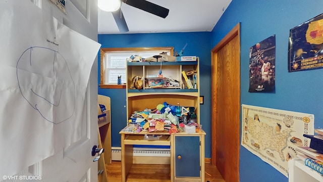 interior space featuring ceiling fan and wood finished floors
