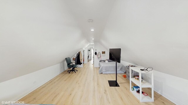 office space featuring recessed lighting, baseboards, vaulted ceiling, and wood finished floors