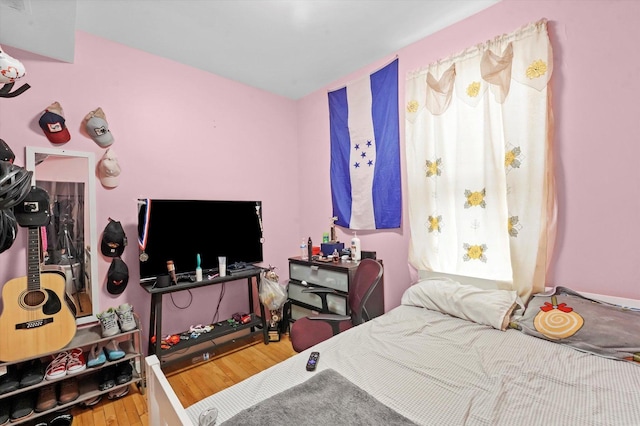 bedroom featuring wood finished floors