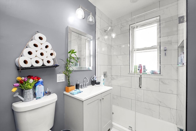 full bath with a shower stall, toilet, and vanity