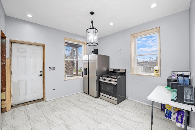 kitchen featuring pendant lighting, stainless steel appliances, and recessed lighting