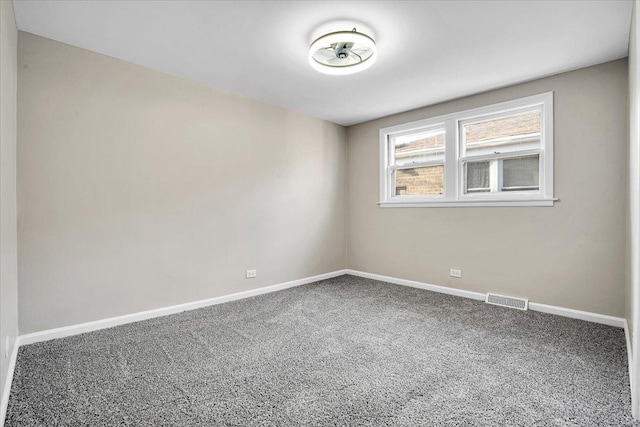 10854 S Union Ave, Chicago, IL 60628 - spare room featuring carpet floors and baseboards