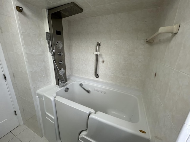 full bathroom featuring tile walls and tile patterned flooring