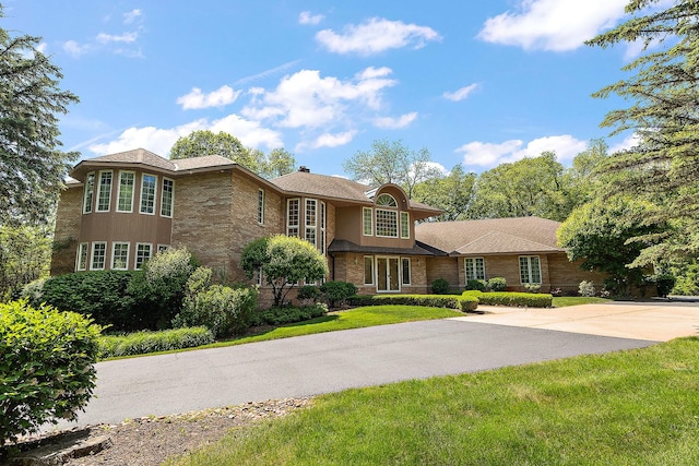 621 Chatfield Rd, New Lenox, IL 60451 - view of front of house featuring brick siding, a front lawn, and driveway