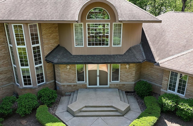 621 Chatfield Rd, New Lenox, IL 60451 - doorway to property featuring roof with shingles and brick siding