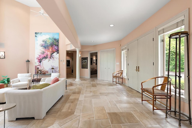 621 Chatfield Rd, New Lenox, IL 60451 - entrance foyer with ornate columns, stone tile flooring, and a ceiling fan