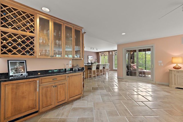 621 Chatfield Rd, New Lenox, IL 60451 - indoor wet bar with baseboards, stone tile flooring, recessed lighting, and rail lighting