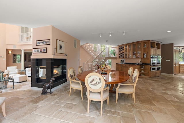 621 Chatfield Rd, New Lenox, IL 60451 - dining room with a fireplace, stairway, and recessed lighting