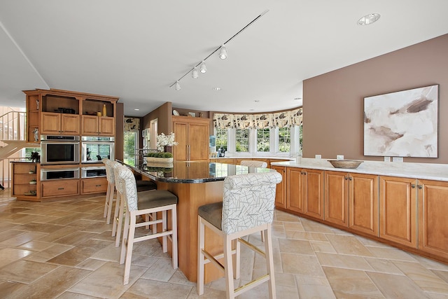 621 Chatfield Rd, New Lenox, IL 60451 - kitchen with a kitchen island, open shelves, oven, a breakfast bar, and recessed lighting