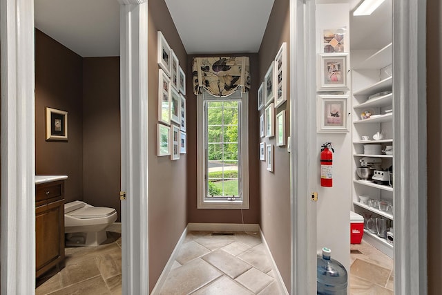 621 Chatfield Rd, New Lenox, IL 60451 - doorway to outside featuring baseboards and light stone finish flooring