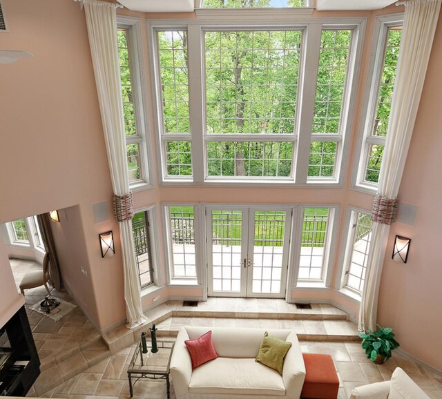 621 Chatfield Rd, New Lenox, IL 60451 - living area with a towering ceiling, baseboards, and french doors