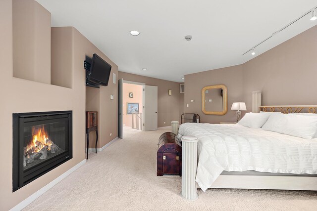 621 Chatfield Rd, New Lenox, IL 60451 - bedroom with light carpet, baseboards, a glass covered fireplace, and recessed lighting