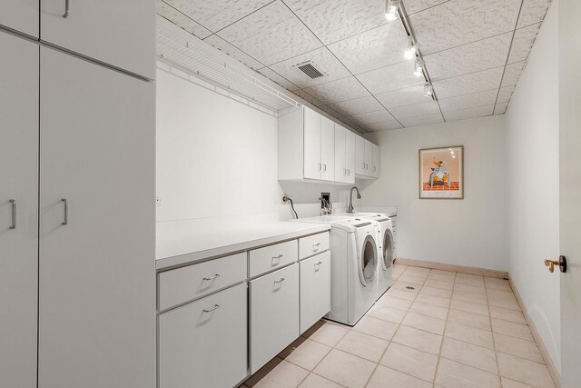621 Chatfield Rd, New Lenox, IL 60451 - laundry room with cabinet space, independent washer and dryer, rail lighting, light tile patterned floors, and baseboards
