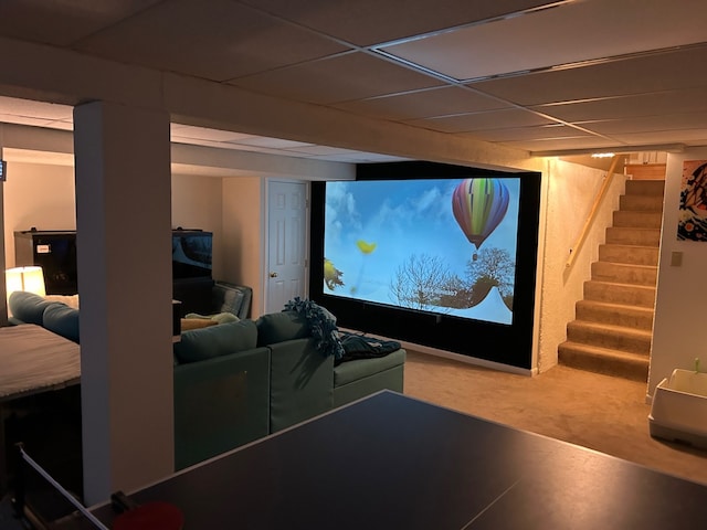 cinema room featuring a drop ceiling
