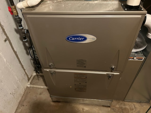 utility room with heating unit