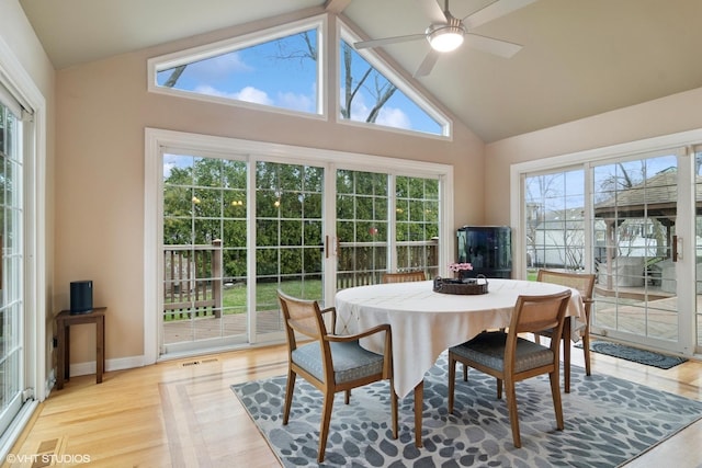 dining room featuring light wood-style flooring, visible vents, ceiling fan, and a healthy amount of sunlight