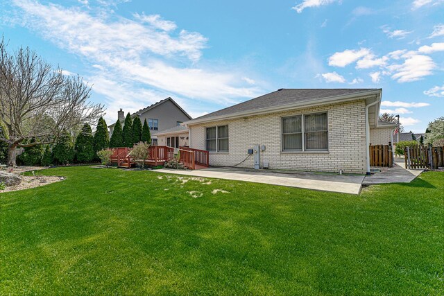 single story home featuring brick siding, driveway, a front lawn, and a garage