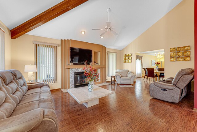 dining space featuring baseboards, stone finish flooring, a towering ceiling, and ceiling fan