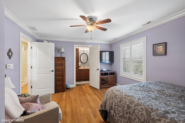 bedroom featuring crown molding, visible vents, light wood-style flooring, and baseboards