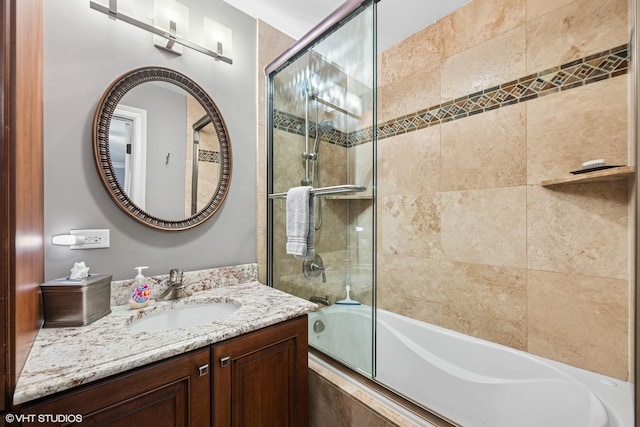 bathroom featuring vanity and tiled shower / bath