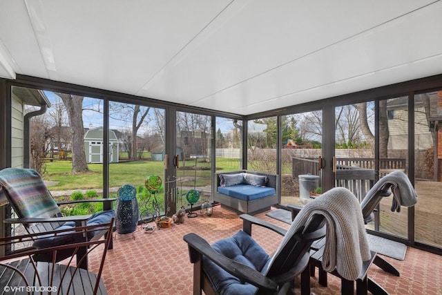 sunroom featuring outdoor lounge area and a healthy amount of sunlight